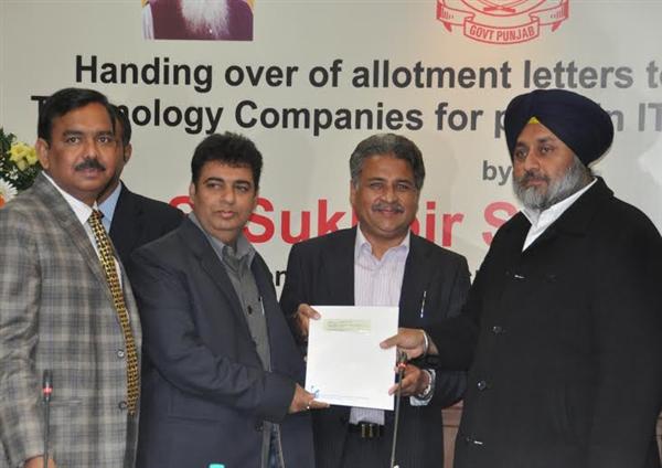 Punjab Deputy Chief Minister Sukhbir Singh Badal handing over land allotment letters to IT companies at Chandigarh