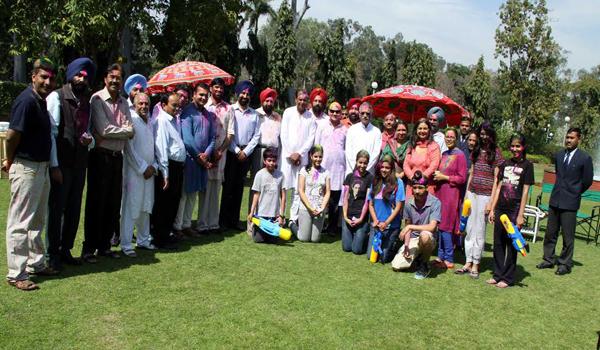 The Punjab Governor Mr. Shivraj V. Patil posing with staff and officers after celebrating Holi at Punjab Raj Bhavan